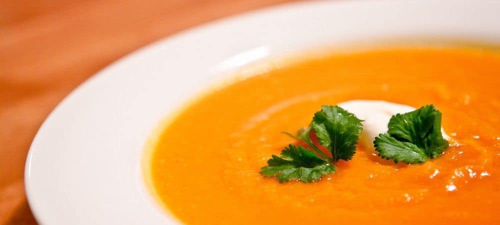 Close-up of a plate of carrot soup.