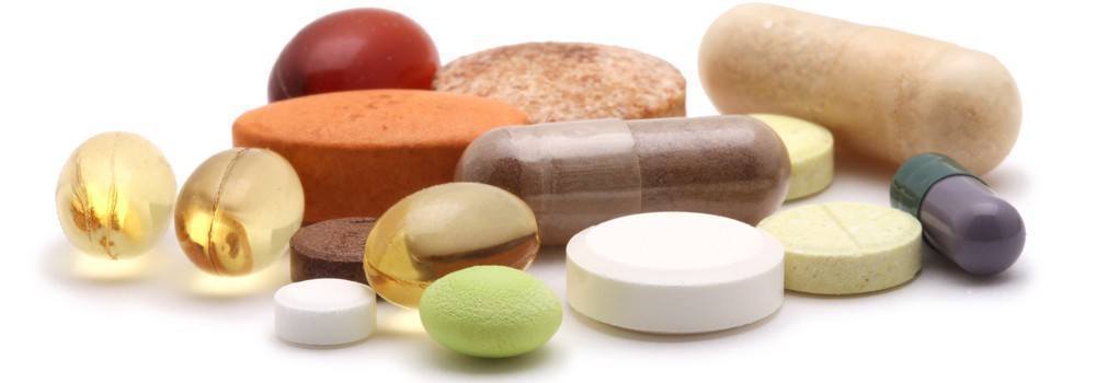 Vitamins of various shapes, colors, and sizes.