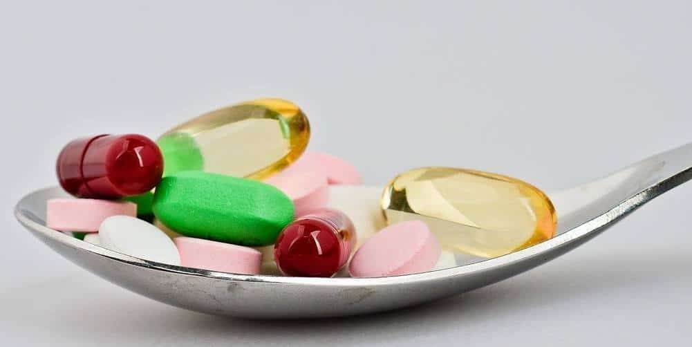 A spoonful of capsules and pills.