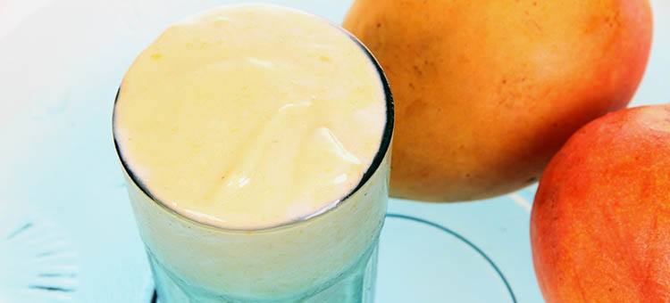 A glass of mango yogurt smoothie