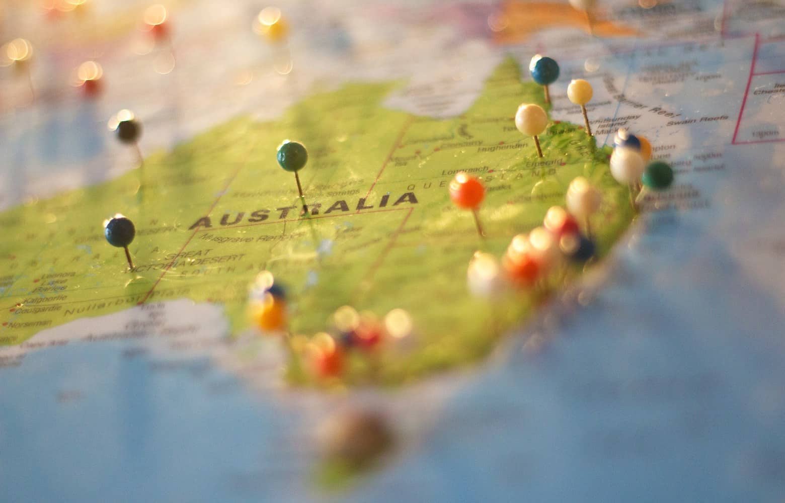 Part of a world map showing Australia with pins.