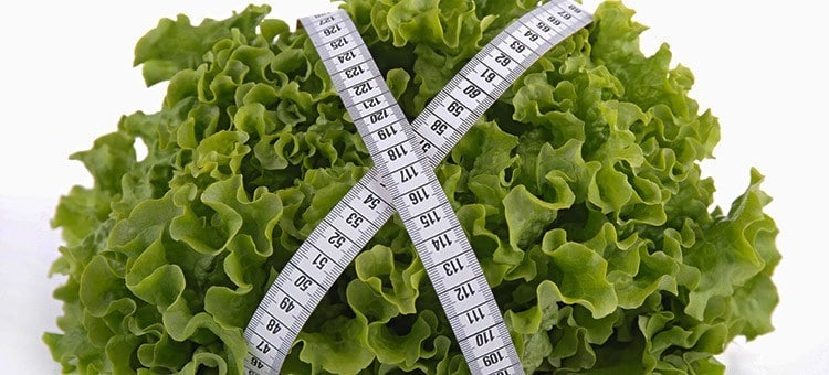 A salad tied with measuring tape.