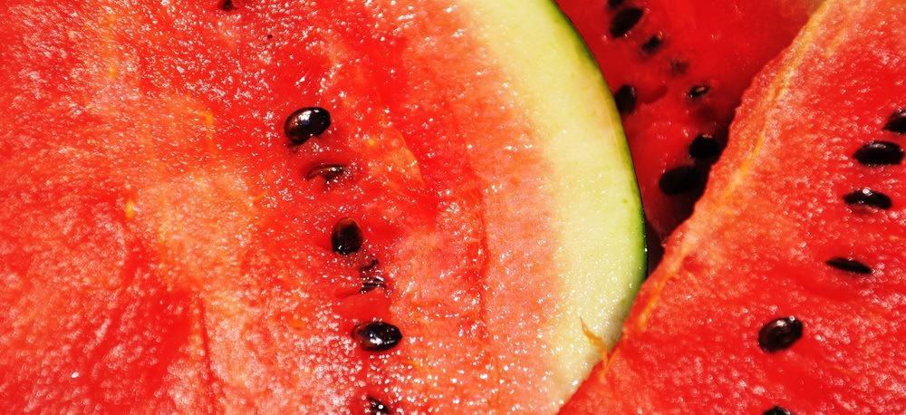Close-up of slices of watermelons with seeds.