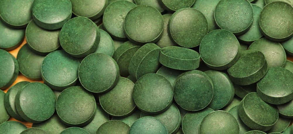 Close-up of a pile of algae tablets.