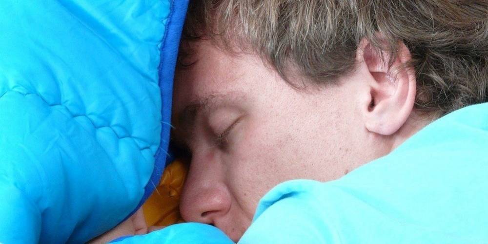 A young man enjoying a deep sleep.