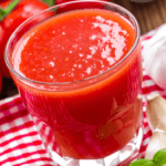 A glass of tomato juice with garlic.