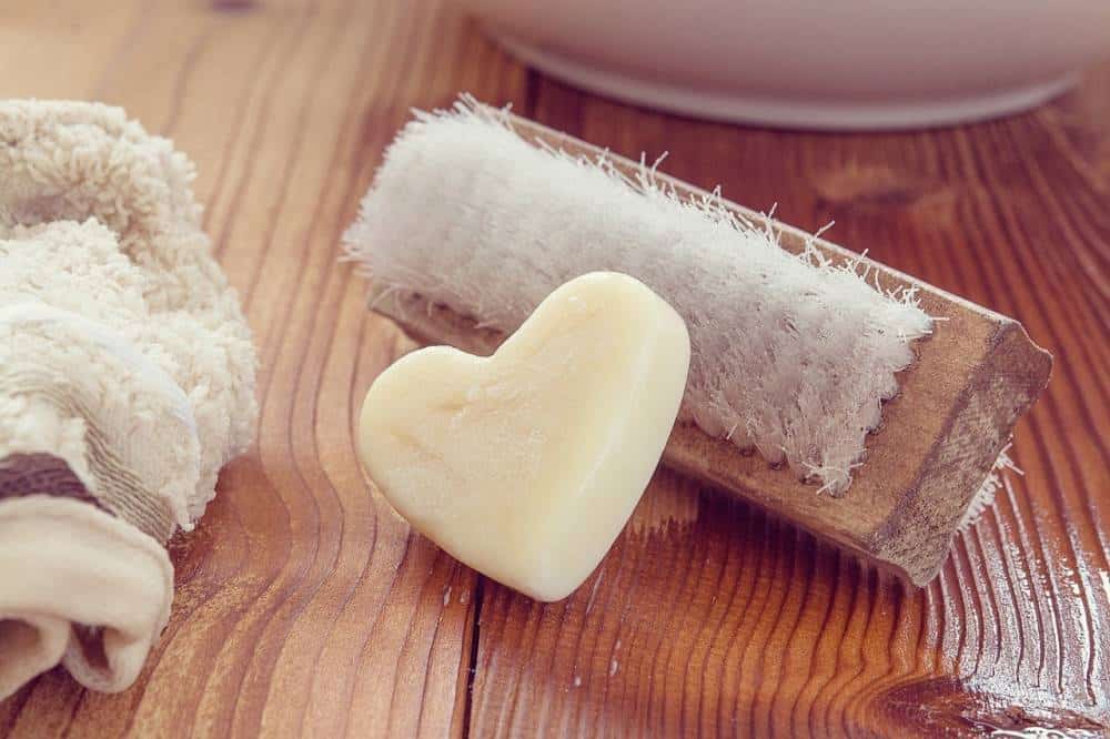 Heart-shaped soap with a brush.