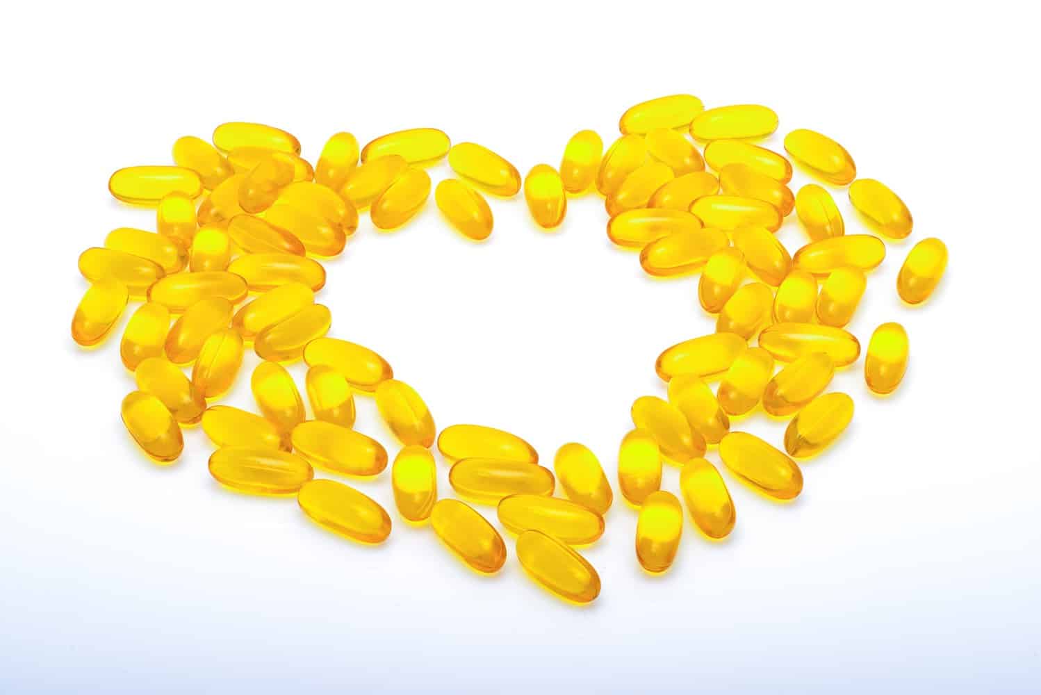 Fish oil capsules forming the shape of a heart.