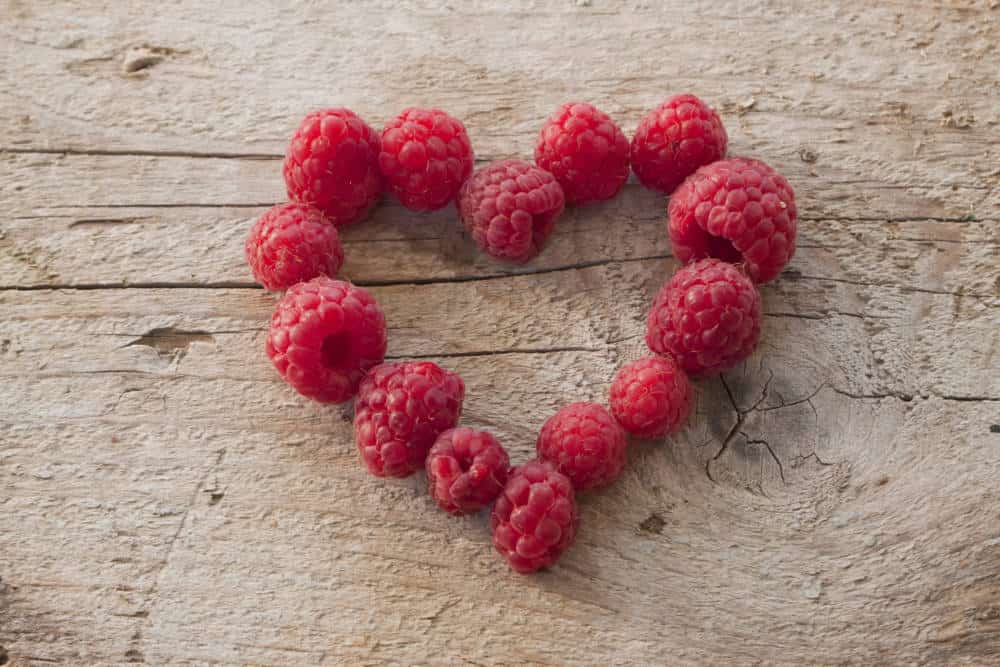 Raspberries in a heart shape.