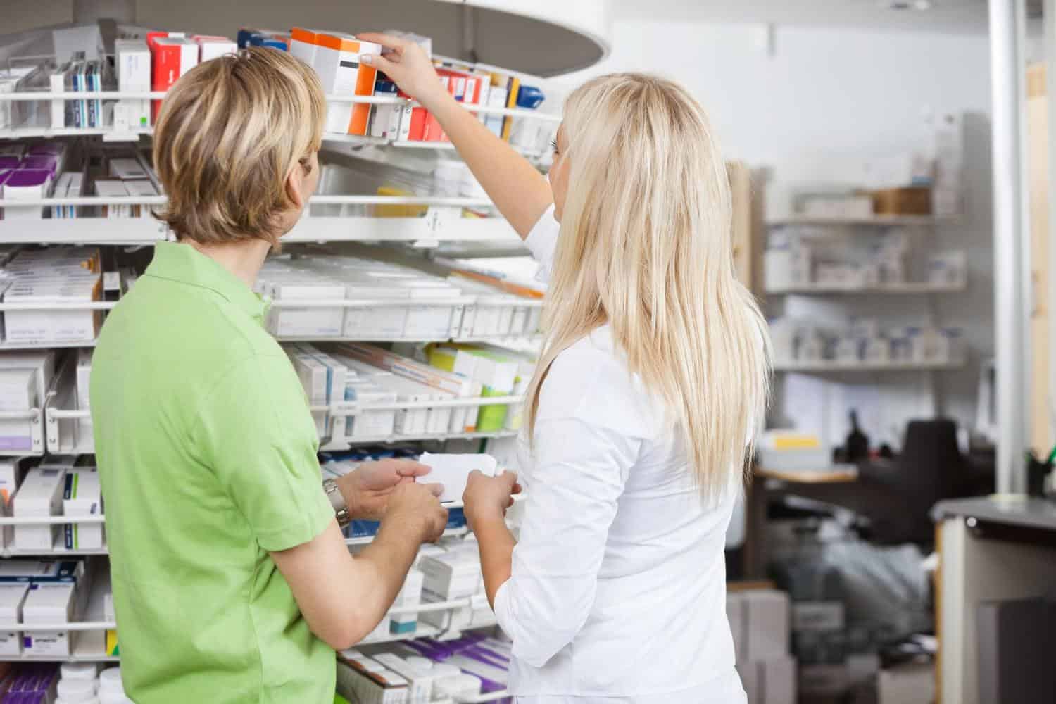 A woman shopping for medicine at a pharmacy