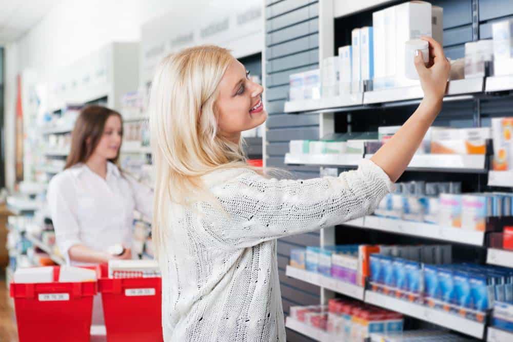 A woman shopping at a pharmacy.
