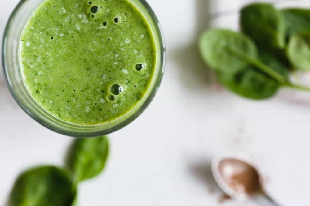 A glass of green spinach juice.